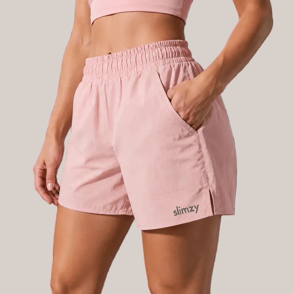 Slimzy women's lightweight quick-drying running shorts with pastel color and side pockets, ideal for active exercise and outdoor running.
