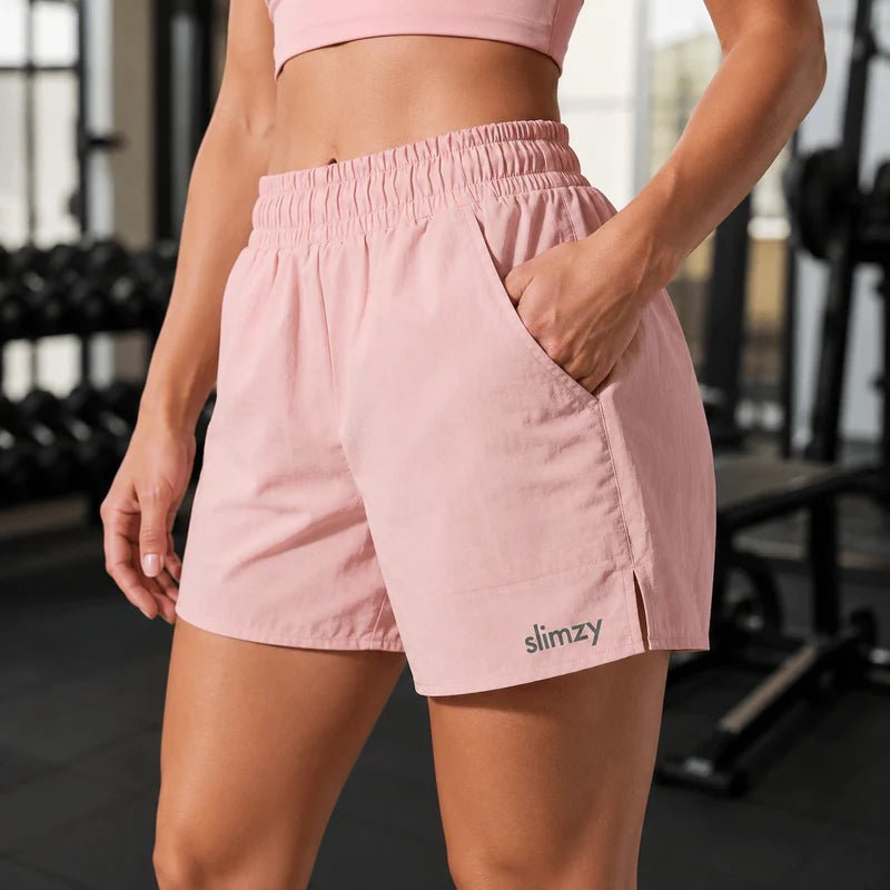 Slimzy women's lightweight quick-drying running shorts with pockets in pastel color, designed for active women.