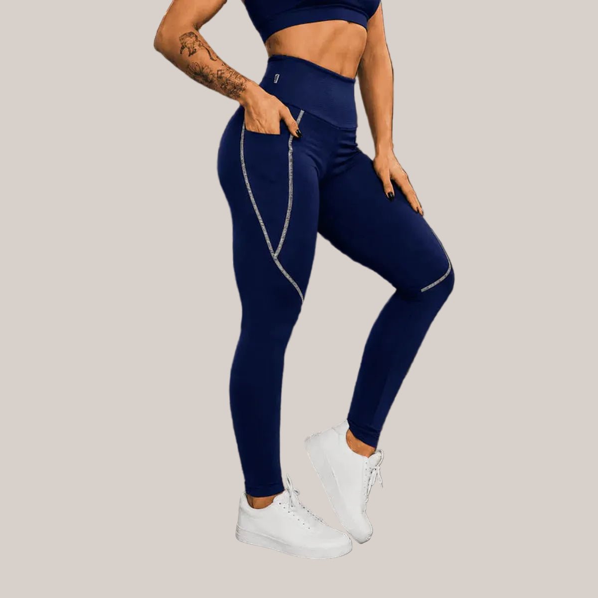 Navy blue Slimzy women's tech pocket leggings with contrast stitching, fitted and stretchy for active wear and casual comfort.