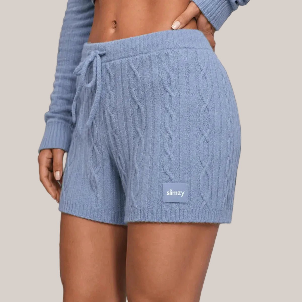 Violet Slimzy women's short knit comfort shorts displayed on a model, showcasing their relaxed fit and soft fabric.