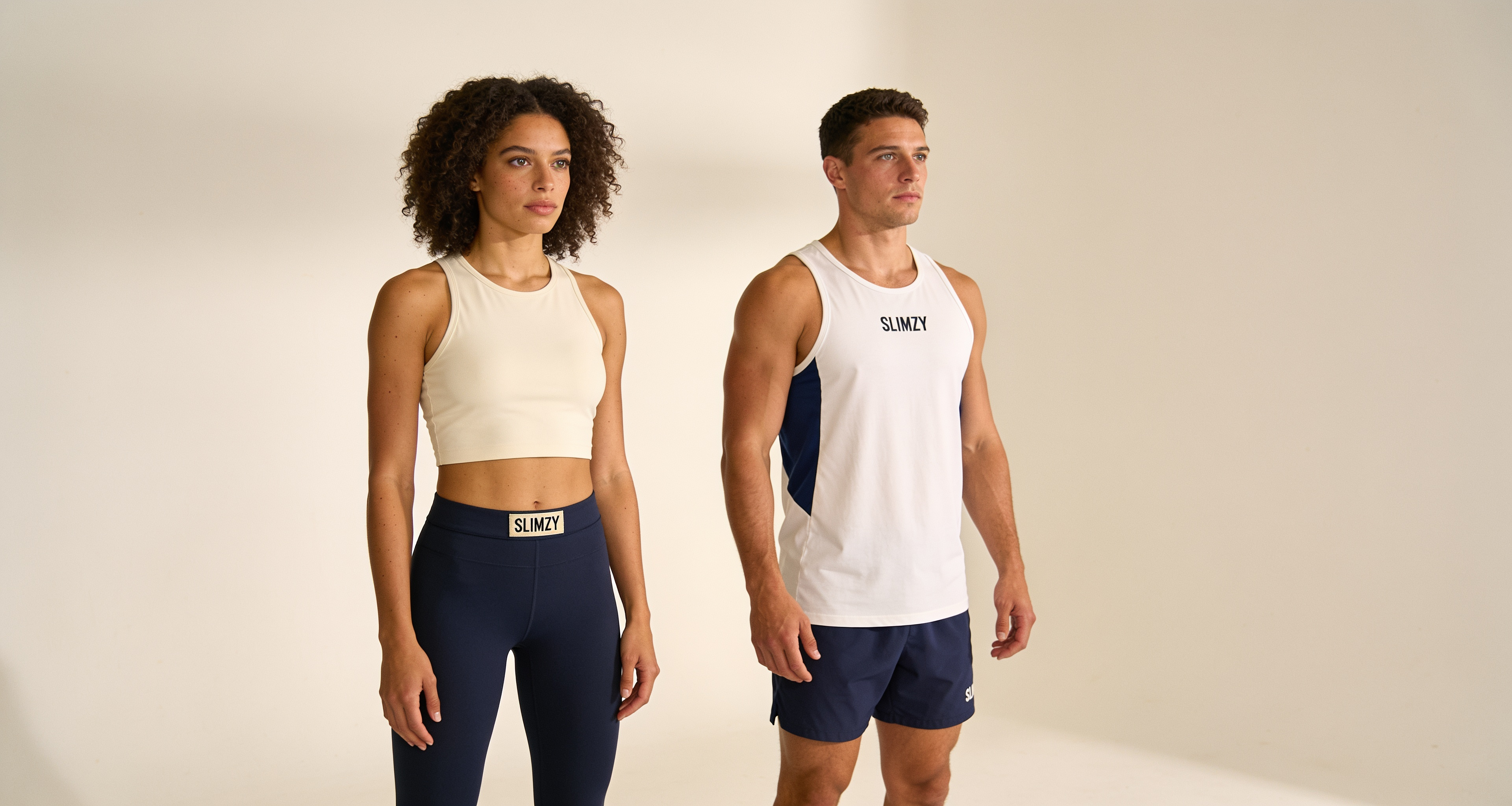 Slimzy activewear campaign — a woman in navy Slimzy leggings and a man in a white Slimzy tank and navy shorts