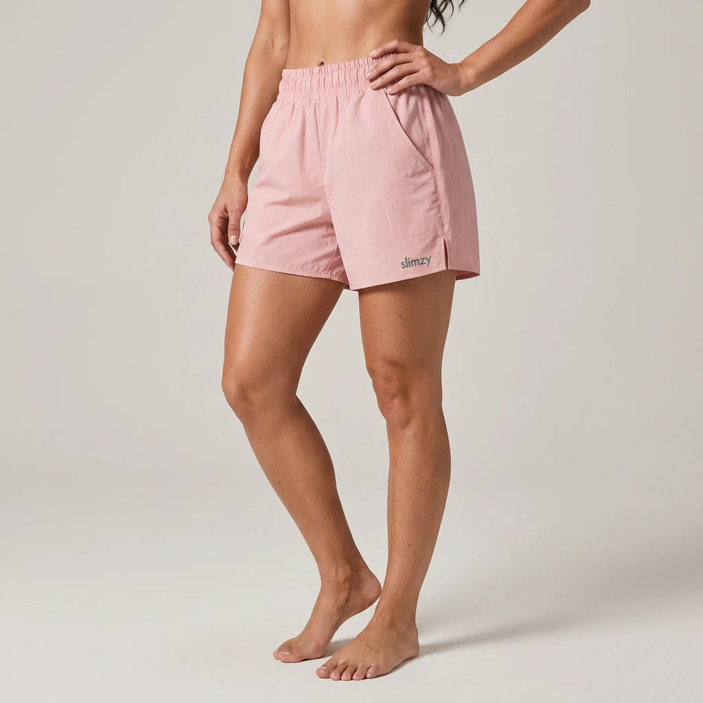 Pink Slimzy women's lightweight quick-drying running shorts with pockets, designed for activewear and comfortable movement.