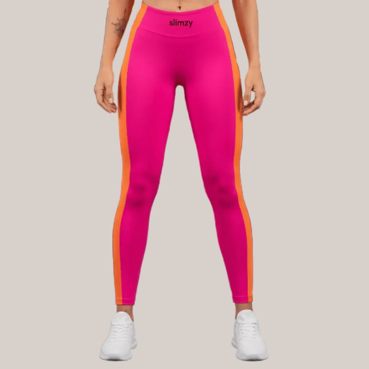 Slimzy women's colour block leggings in pink and orange, featuring a stylish and comfortable fit with vibrant color blocking design.