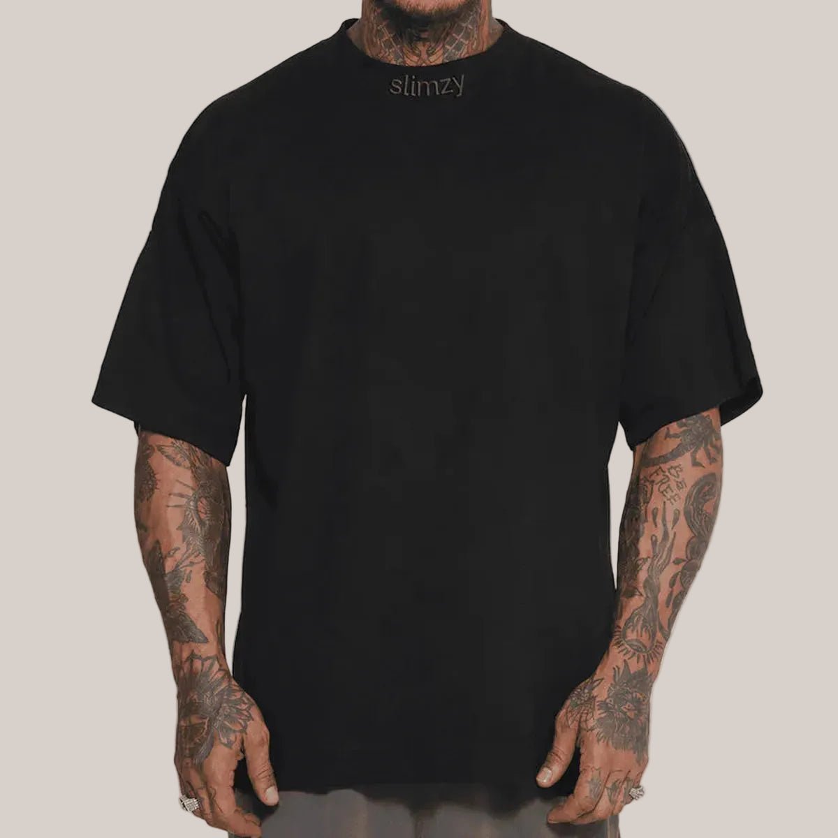 Black Slimzy men's oversized street T-shirt, casual fit with a relaxed style, displayed on a plain background.