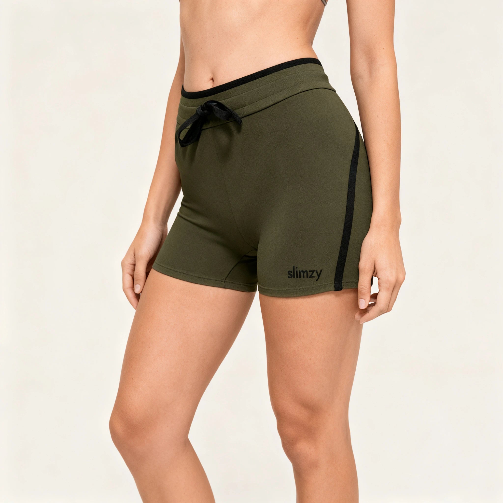 Dark green Slimzy women's drawstring fitness shorts made of breathable performance fabric, ideal for activewear and workouts.