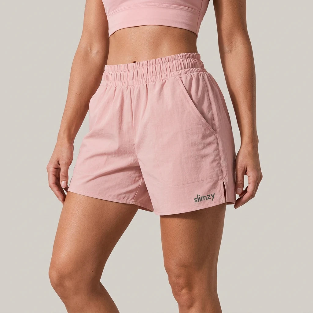 Pink Slimzy women's lightweight quick-drying running shorts with pockets, designed for activewear and athletic activities.