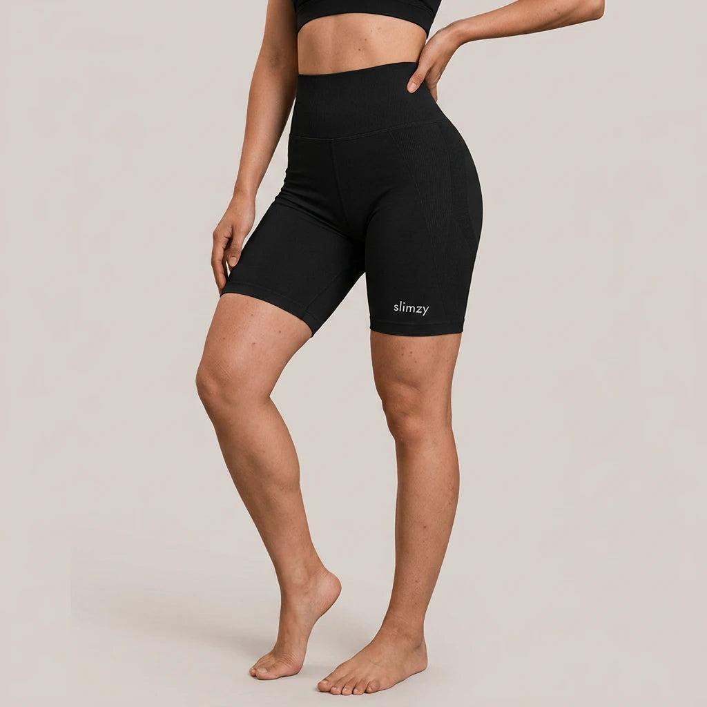 Black Slimzy women's ribbed high-waisted fitness shorts, close-up of stretchy fabric and comfortable fit for activewear.